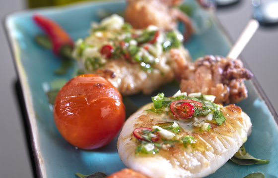 Baby squid skewers with garlic and parsley